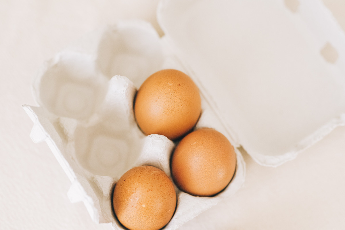 Brown eggs in a white container